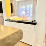 ferienhaus_magicfire_luxus_gemuetlich_chalet_natursteinarbeitsplatte_wohnraum_tauberchalet